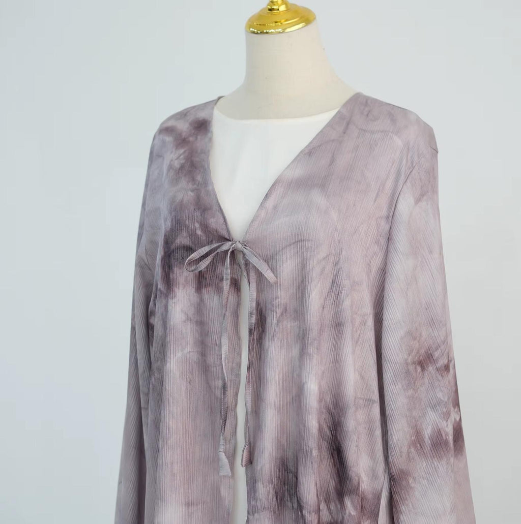 Elegant tie-dye abaya with a beautiful flowing finish, wide sleeves and an adjustable front tie. Lightweight, modest and stylish, perfect for Eid, Ramadan, weddings, parties, special occasions or evening wear.