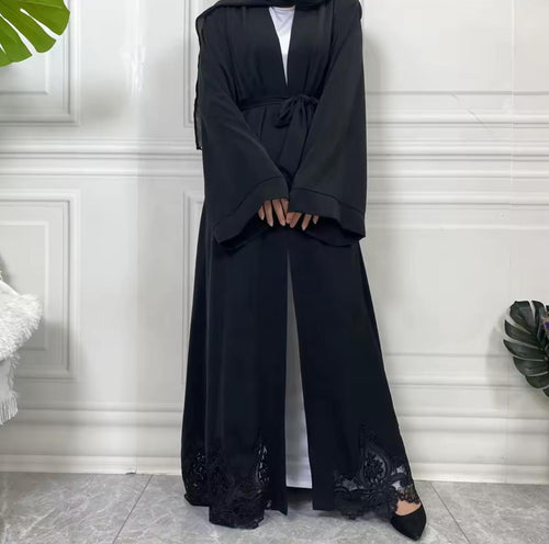 Elegant open Nida abaya with delicate lace hem and matching belt. Lightweight, flowing and modest, perfect for Eid, Ramadan, weddings, occasions or everyday wear. Wear open for layering or tie at the waist for a flattering fit.