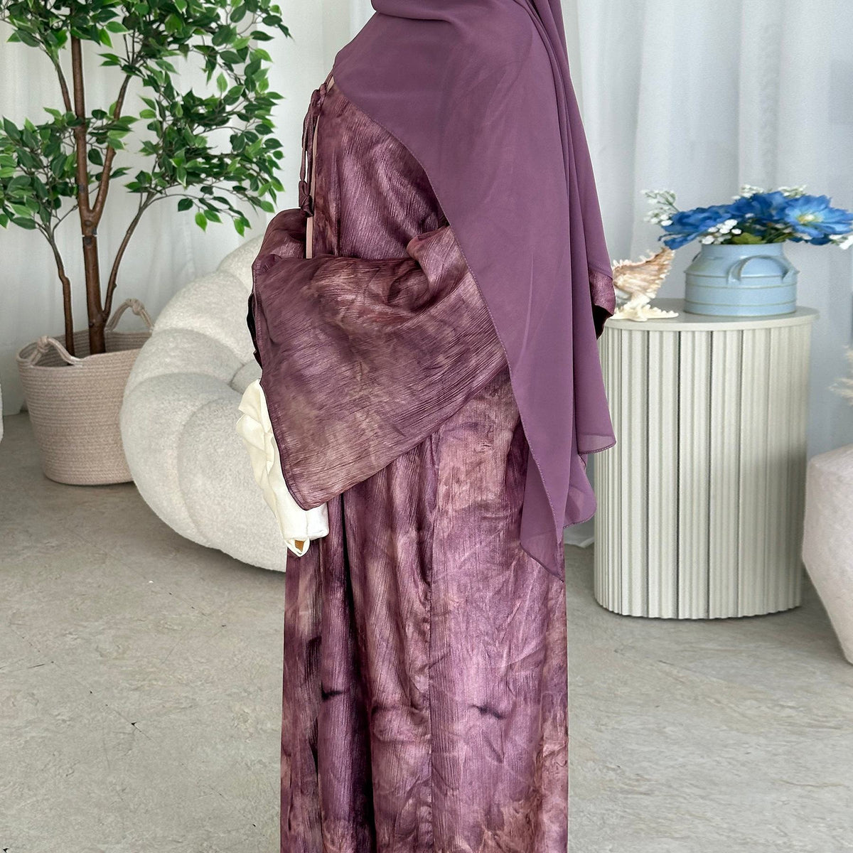 Elegant tie-dye abaya with a beautiful flowing finish, wide sleeves and an adjustable front tie. Lightweight, modest and stylish, perfect for Eid, Ramadan, weddings, parties, special occasions or evening wear.