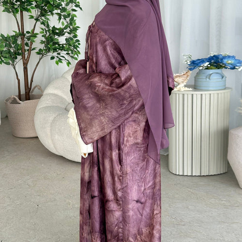 Elegant tie-dye abaya with a beautiful flowing finish, wide sleeves and an adjustable front tie. Lightweight, modest and stylish, perfect for Eid, Ramadan, weddings, parties, special occasions or evening wear.
