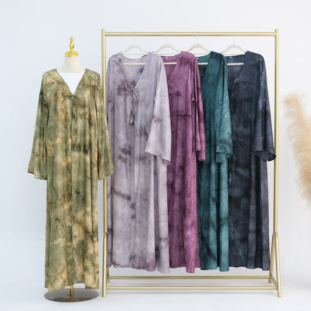 Elegant tie-dye abaya with a beautiful flowing finish, wide sleeves and an adjustable front tie. Lightweight, modest and stylish, perfect for Eid, Ramadan, weddings, parties, special occasions or evening wear.