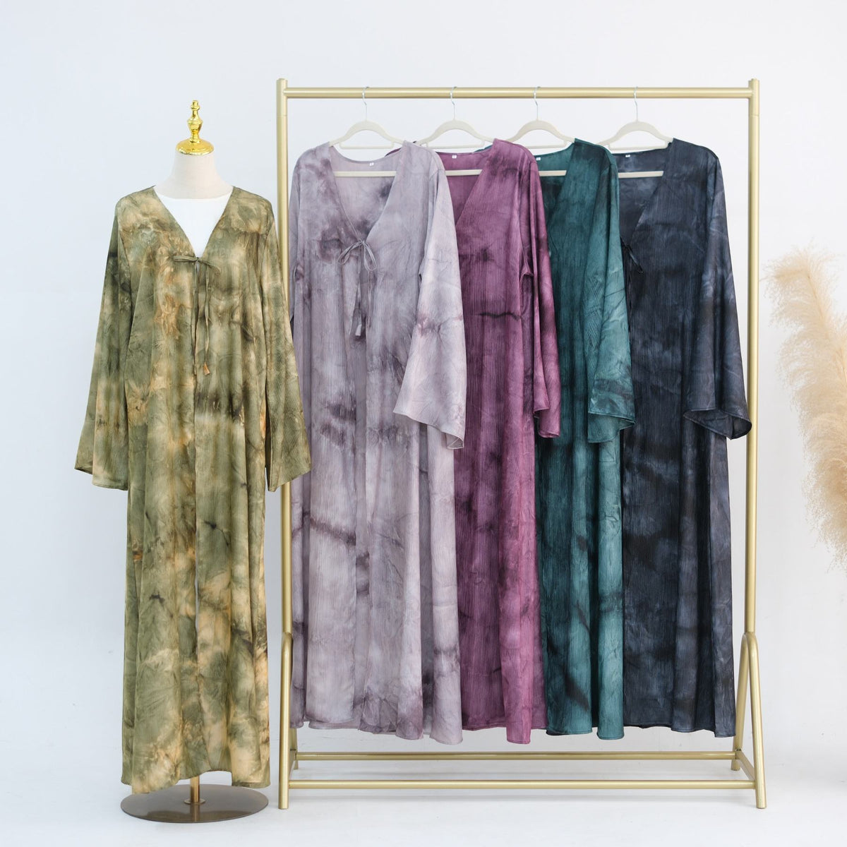 Elegant tie-dye abaya with a beautiful flowing finish, wide sleeves and an adjustable front tie. Lightweight, modest and stylish, perfect for Eid, Ramadan, weddings, parties, special occasions or evening wear.