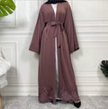 Elegant open Nida abaya with delicate lace hem and matching belt. Lightweight, flowing and modest, perfect for Eid, Ramadan, weddings, occasions or everyday wear. Wear open for layering or tie at the waist for a flattering fit.