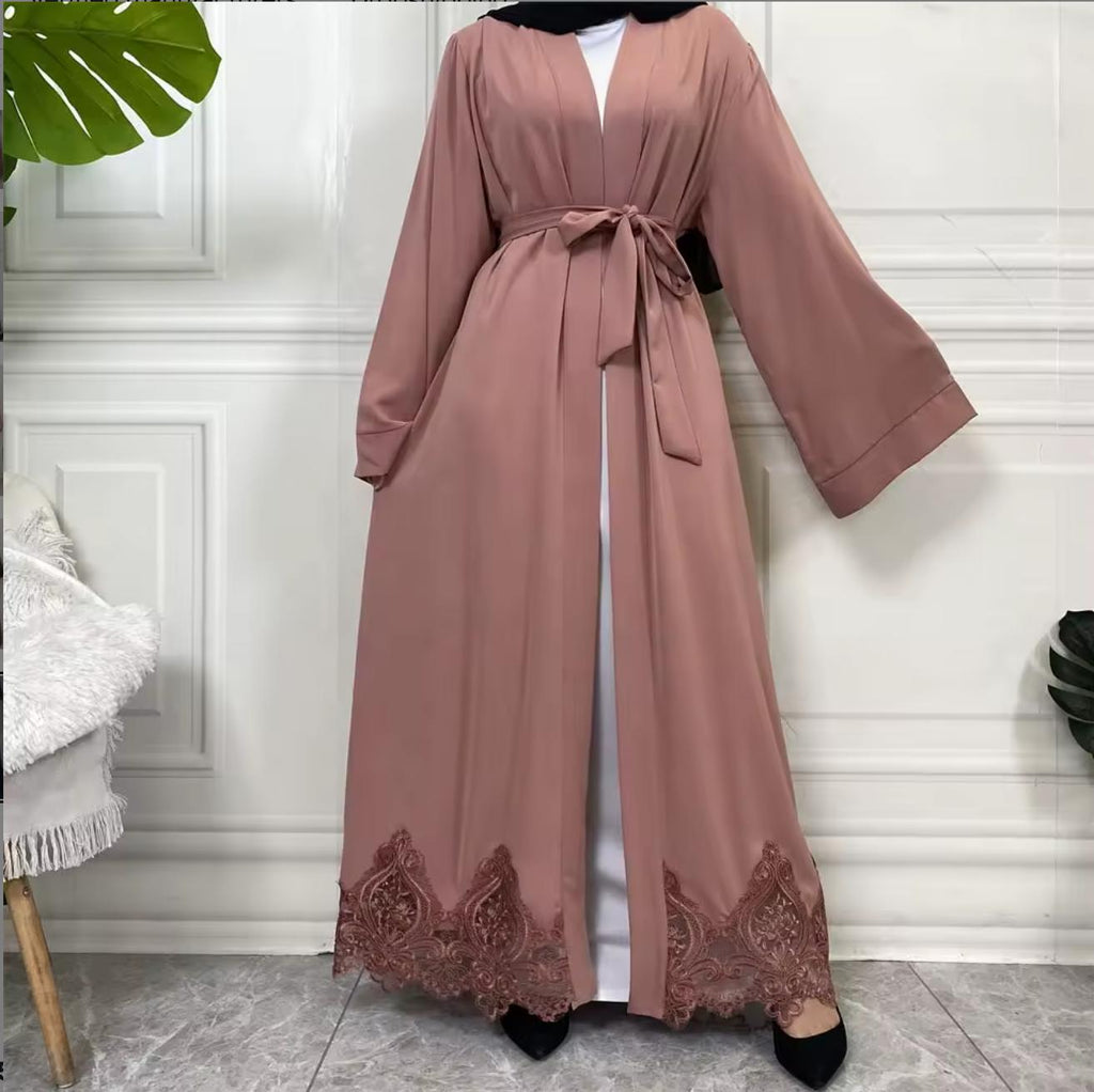 Elegant open Nida abaya with delicate lace hem and matching belt. Lightweight, flowing and modest, perfect for Eid, Ramadan, weddings, occasions or everyday wear. Wear open for layering or tie at the waist for a flattering fit.