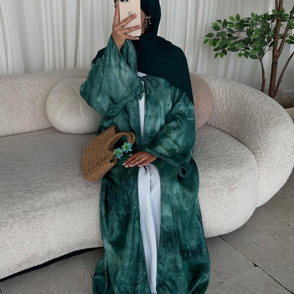 Elegant tie-dye abaya with a beautiful flowing finish, wide sleeves and an adjustable front tie. Lightweight, modest and stylish, perfect for Eid, Ramadan, weddings, parties, special occasions or evening wear.