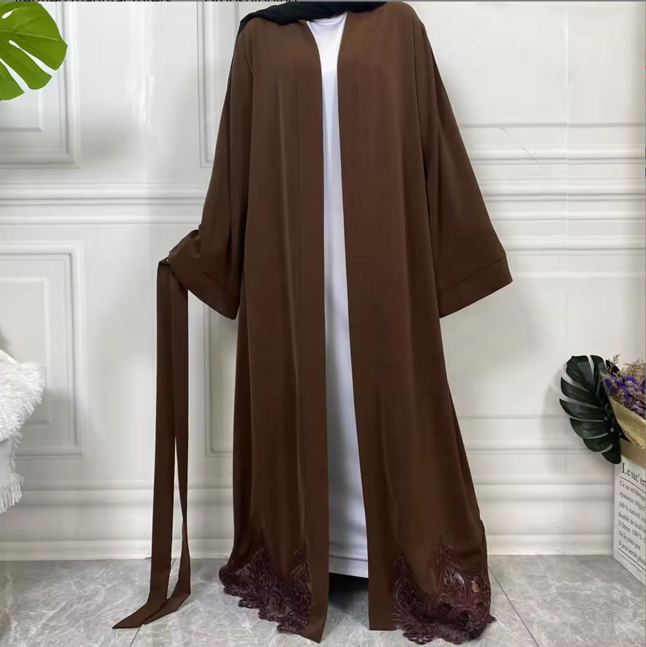 Elegant open Nida abaya with delicate lace hem and matching belt. Lightweight, flowing and modest, perfect for Eid, Ramadan, weddings, occasions or everyday wear. Wear open for layering or tie at the waist for a flattering fit.