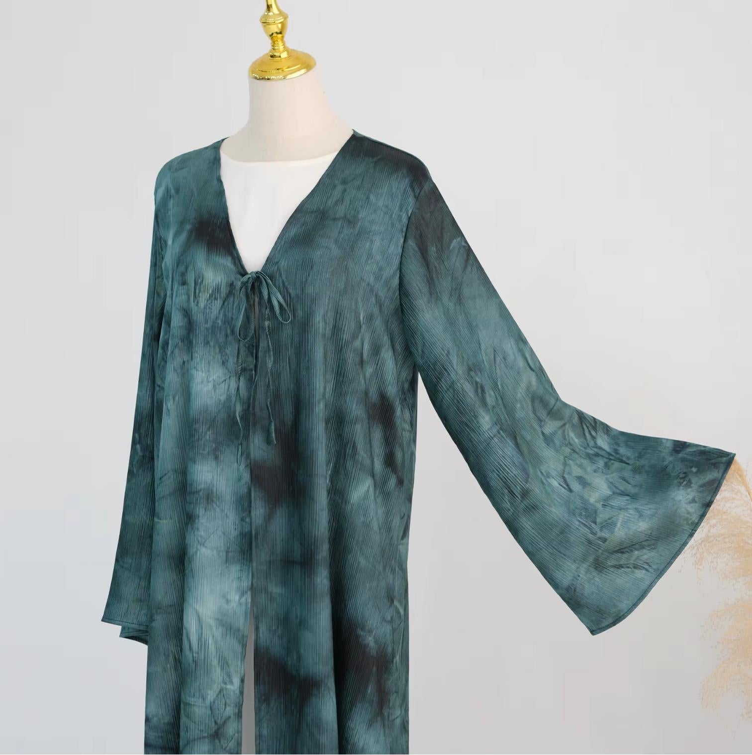 Elegant tie-dye abaya with a beautiful flowing finish, wide sleeves and an adjustable front tie. Lightweight, modest and stylish, perfect for Eid, Ramadan, weddings, parties, special occasions or evening wear.