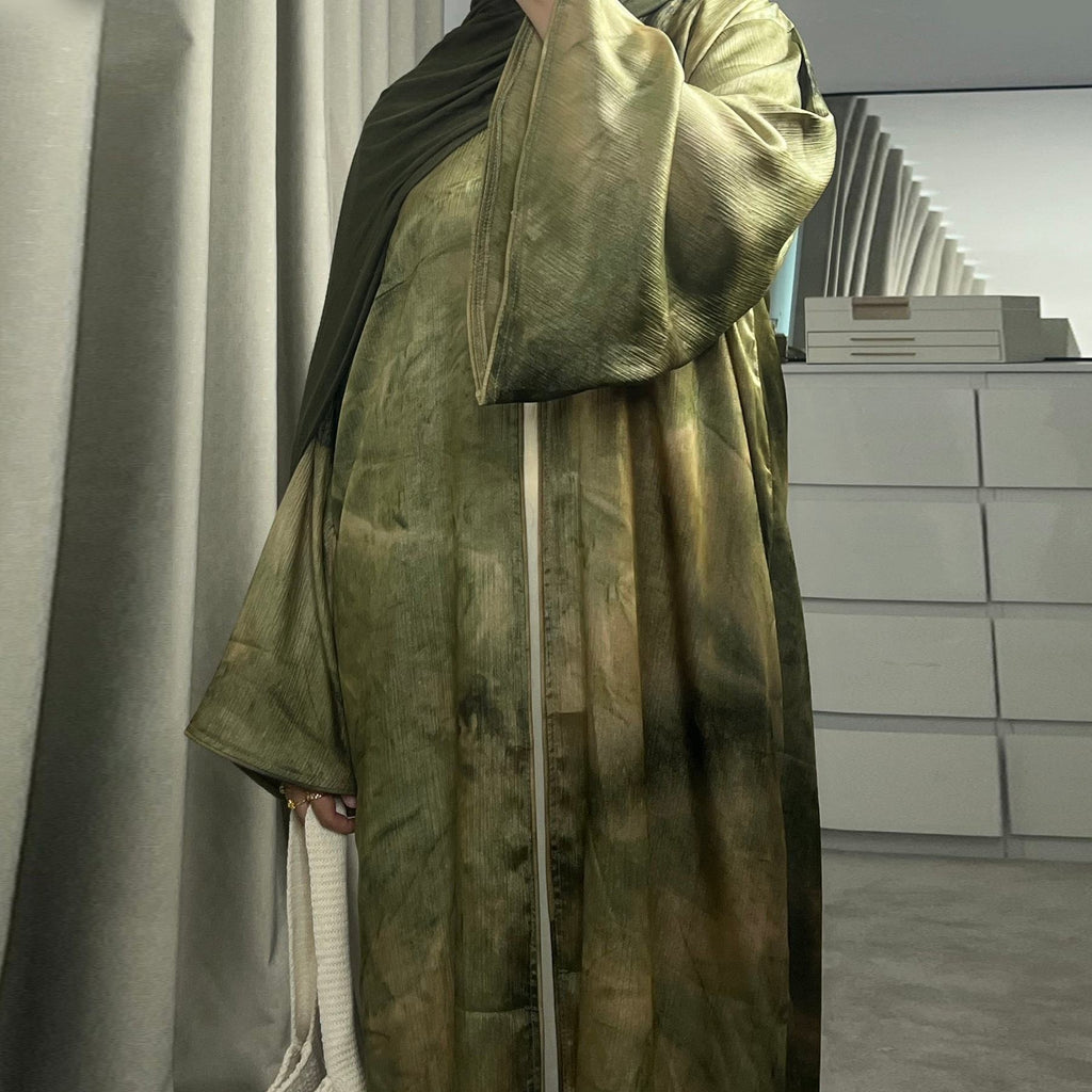 Elegant tie-dye abaya with a beautiful flowing finish, wide sleeves and an adjustable front tie. Lightweight, modest and stylish, perfect for Eid, Ramadan, weddings, parties, special occasions or evening wear.